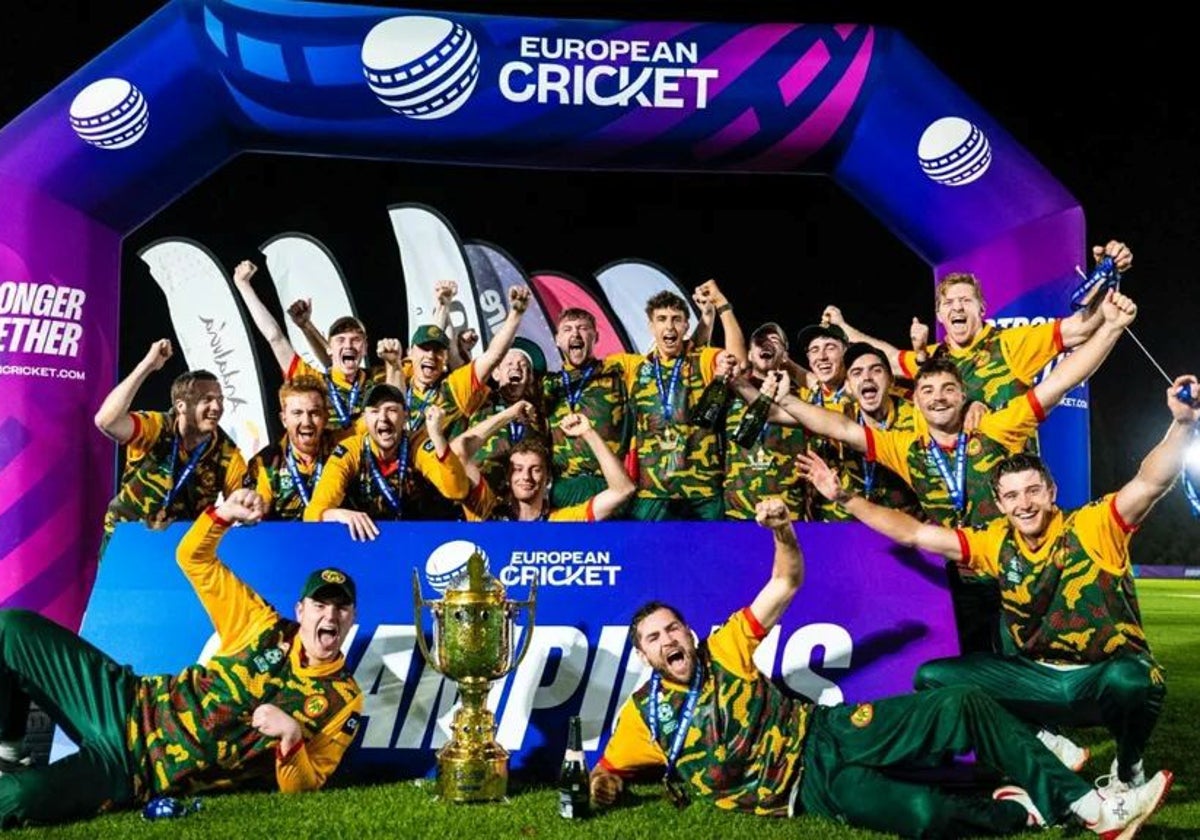 The victorious Farmers players pose with the trophy.